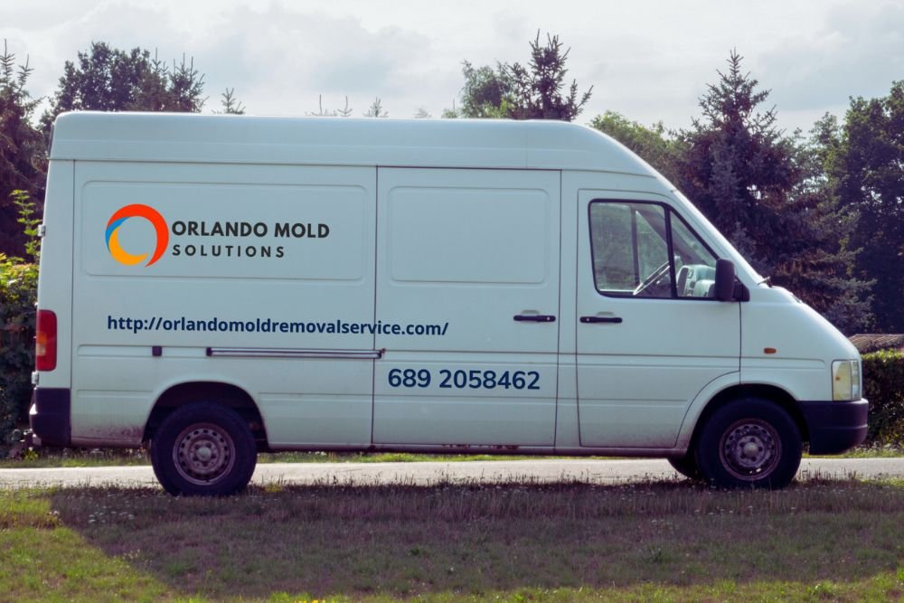 White van featuring the Orlando Plumbers logo, indicating a mold removal service based in Orlando, Florida.