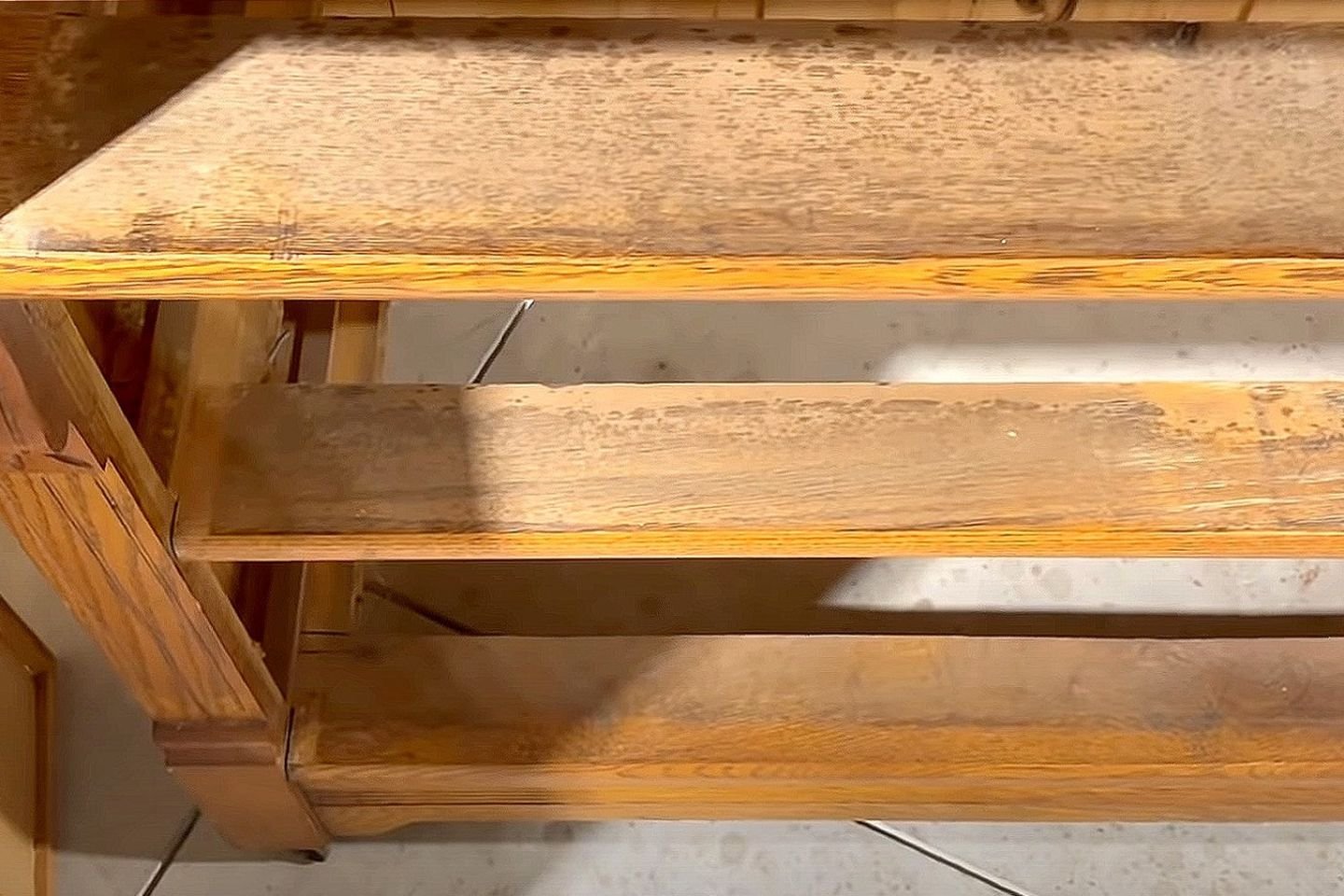 Wooden shelf with an under-shelf, depicting a wood mold removal service operating in Orlando, FL.